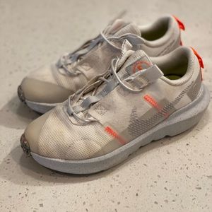 Girl’s White Nike’s with orange detail. size 1.5